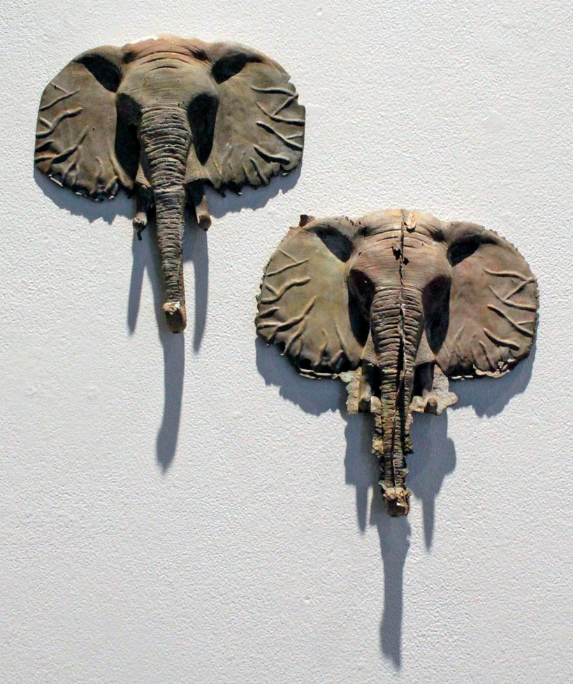 cast bronze elephant heads