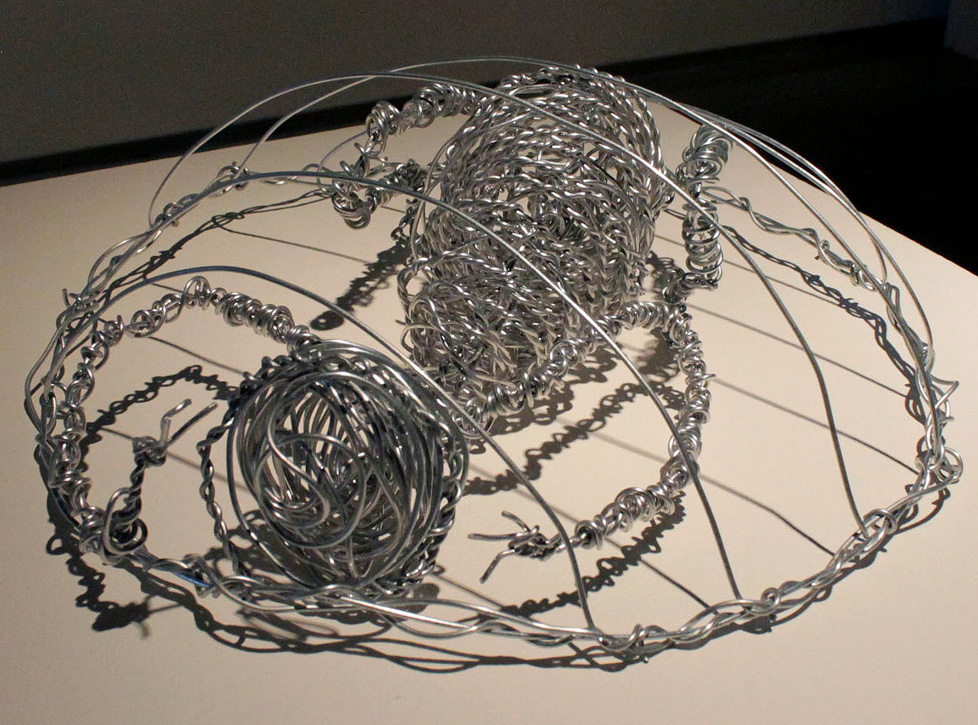 wire sculpture: figure in domed cage