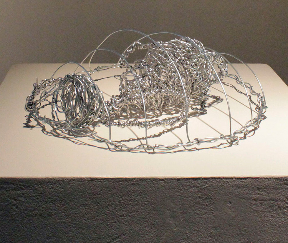 wire sculpture: figure in domed cage