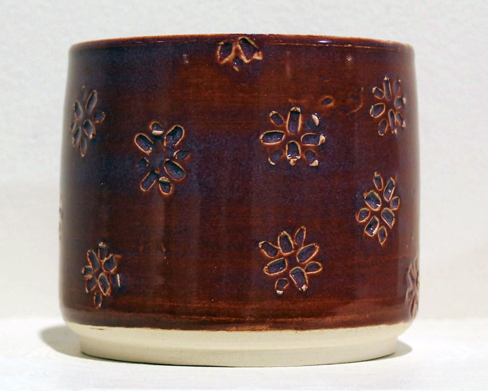 merlot cylindrical jar with small stamped floral pattern