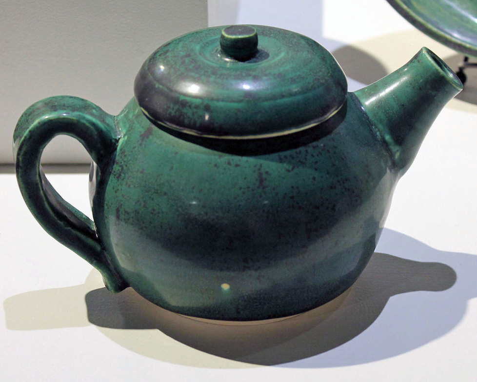 green ceramic teapot