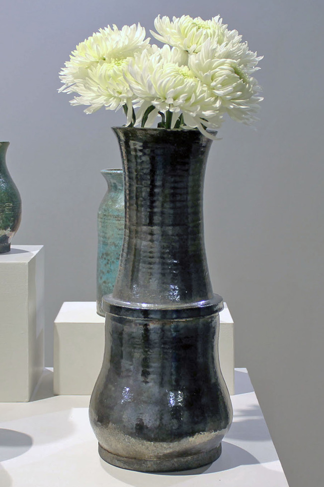 tall vase with white flowers, metalic finish