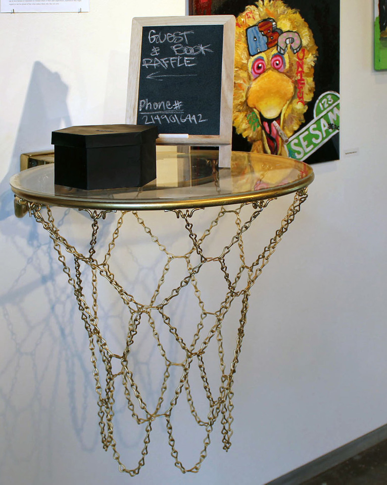 glass shelf on gold painted basketball hoop