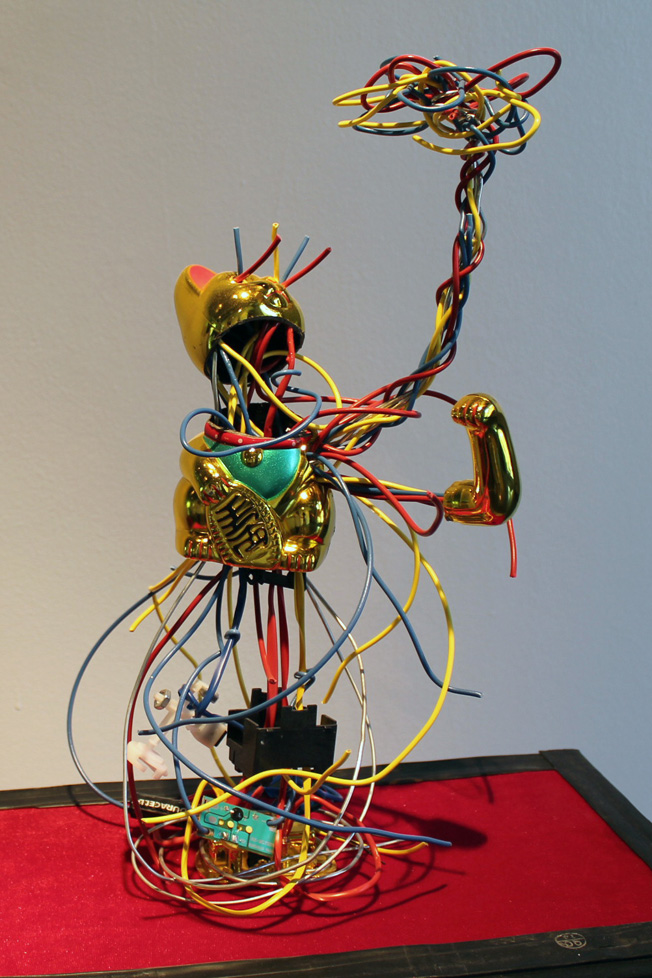 golden cat toy exploding with wires