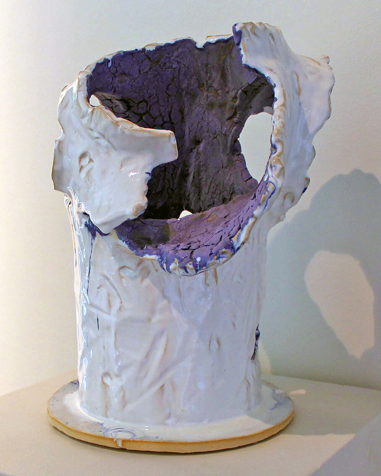 crumbling white ceramic cylinder with purple interior