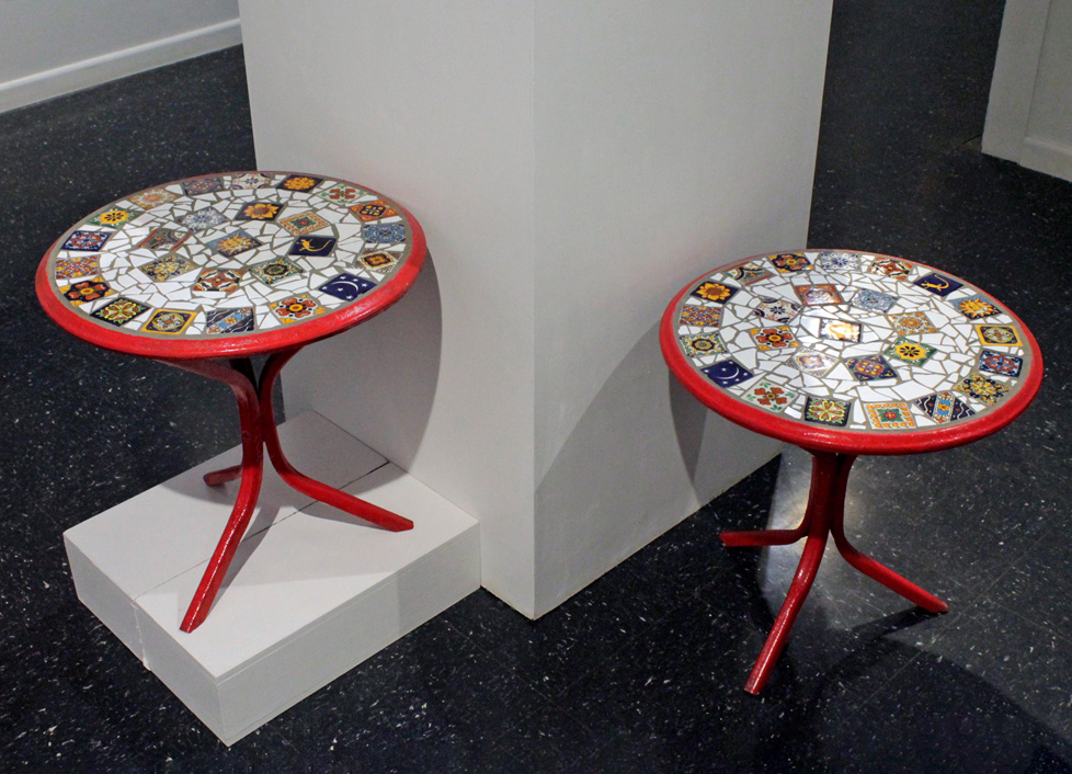 small round tables painted red with tiled tops
