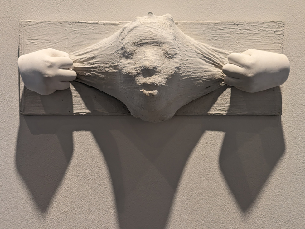 plaster cast sculpture on wall