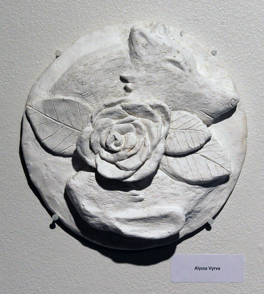 low relief plaster wolf and rose
