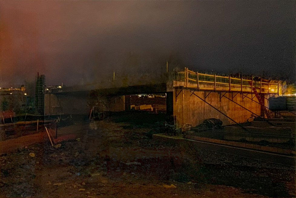 color photo of construction site at night