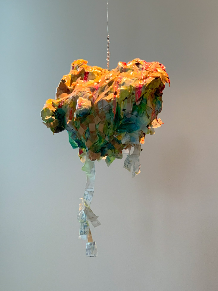 sculpture: form made of bandages and wrappers, hanging from ceiling