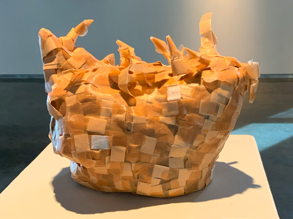 sculpture: purse-like shape made of band-aids