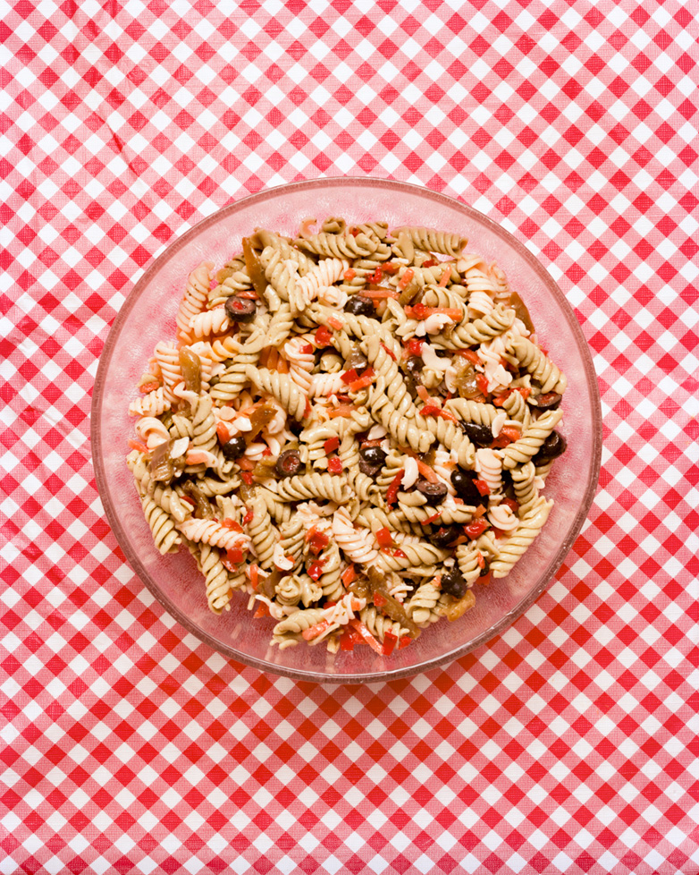 photo of pasta on red and white checked tablecloth