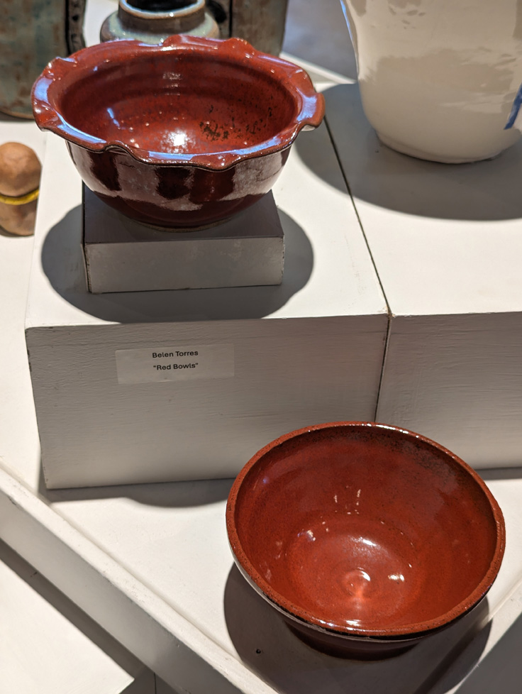 two ceramic bowls, one with petal-like rim