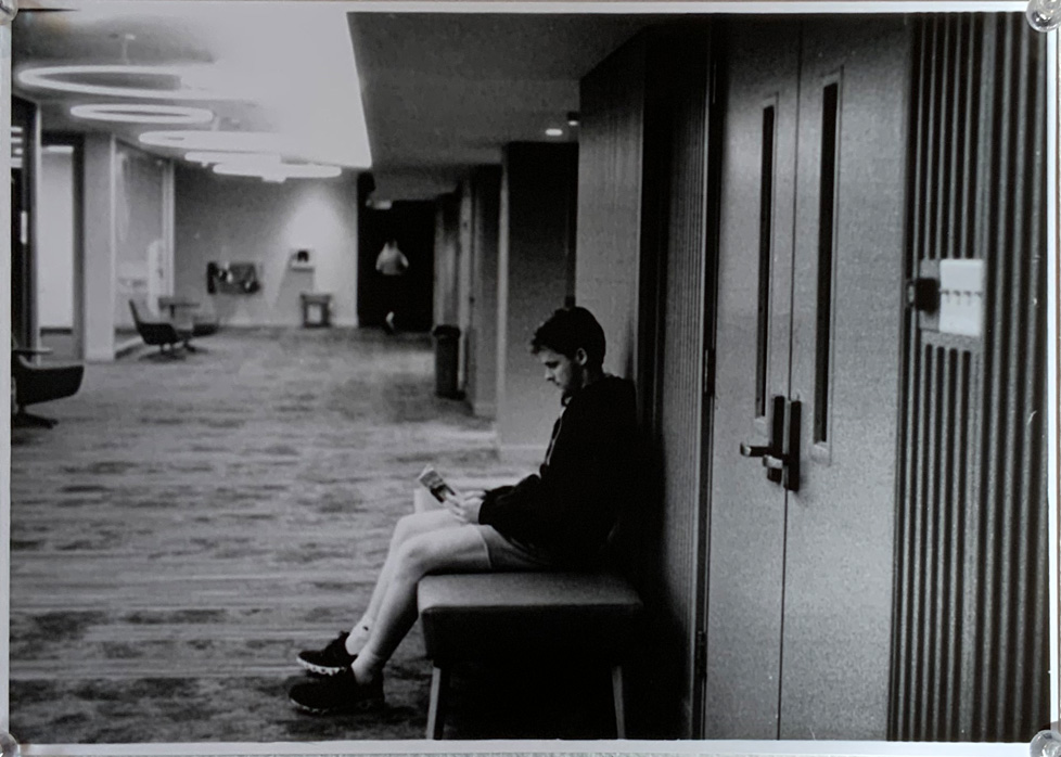 photo of person on bench in hall of Ida Green