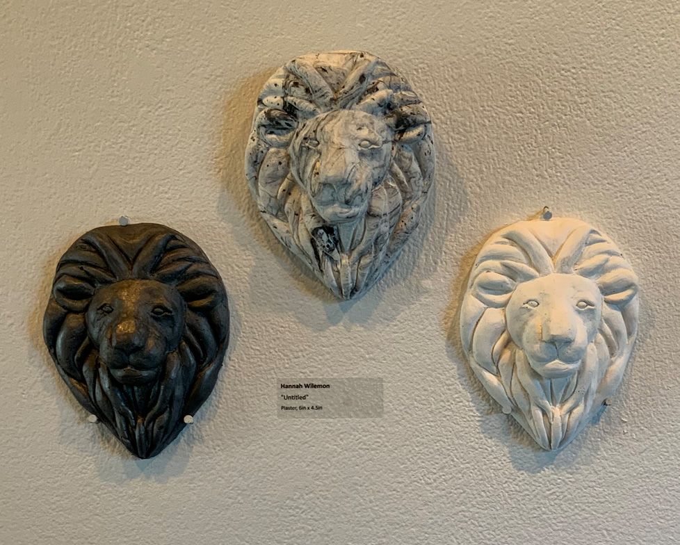 3 plaster lion heads