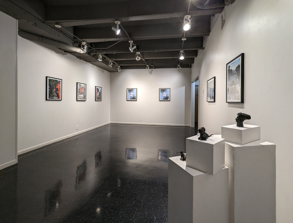 Installation view of gallery: framed digital prints on the walls and a few 3D prints on pedestals