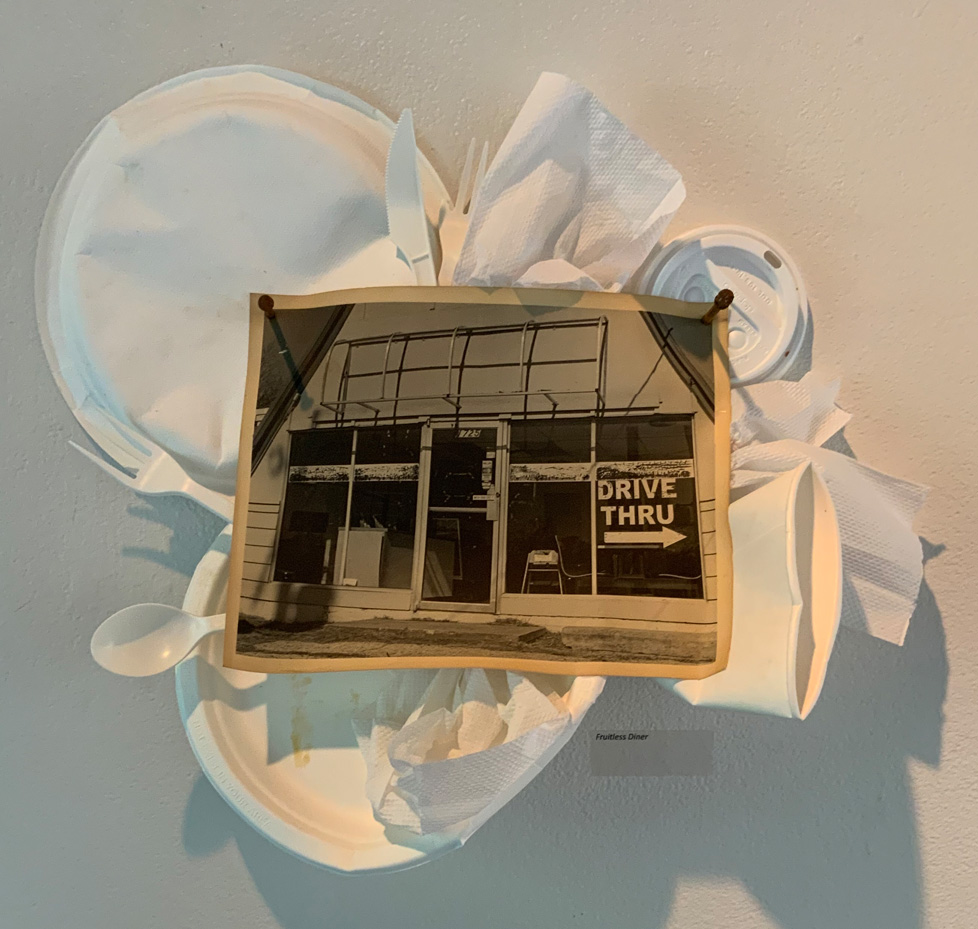 photo of storefront with paper plates