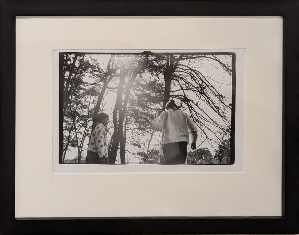 framed and mated b/w photograph