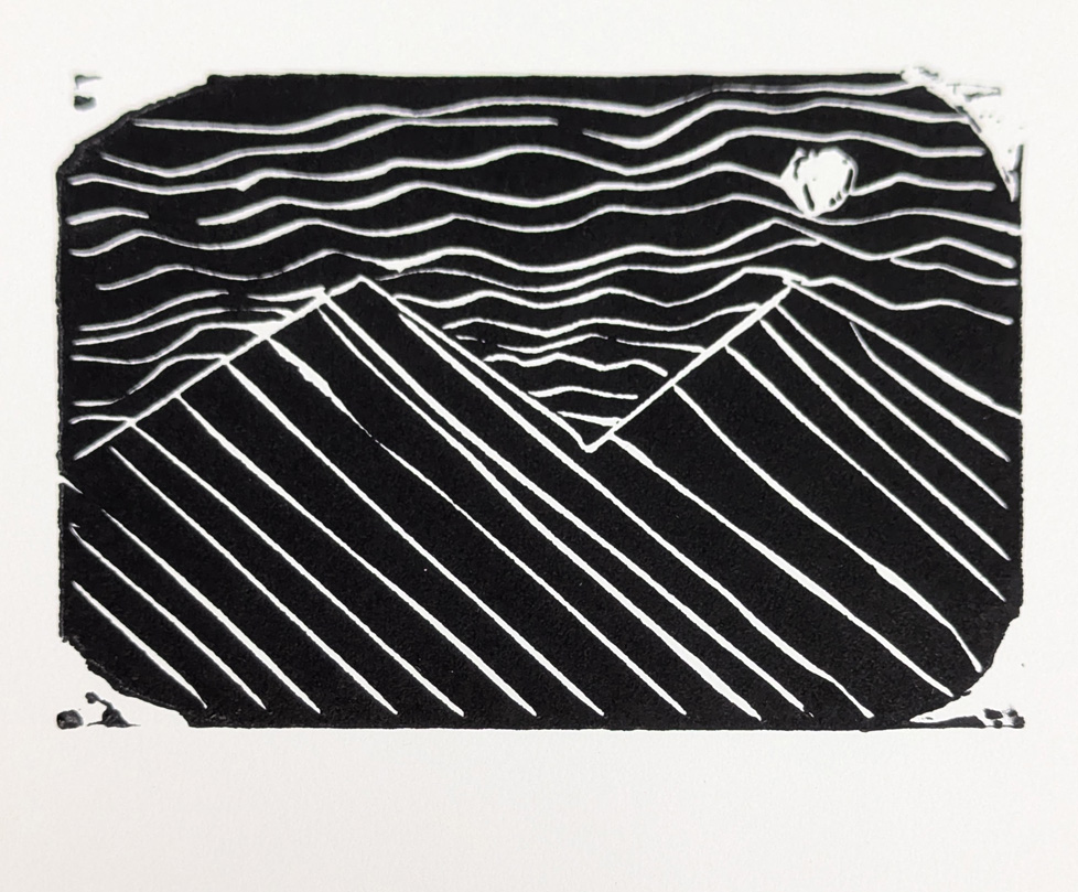 print of mountians and sun or moon