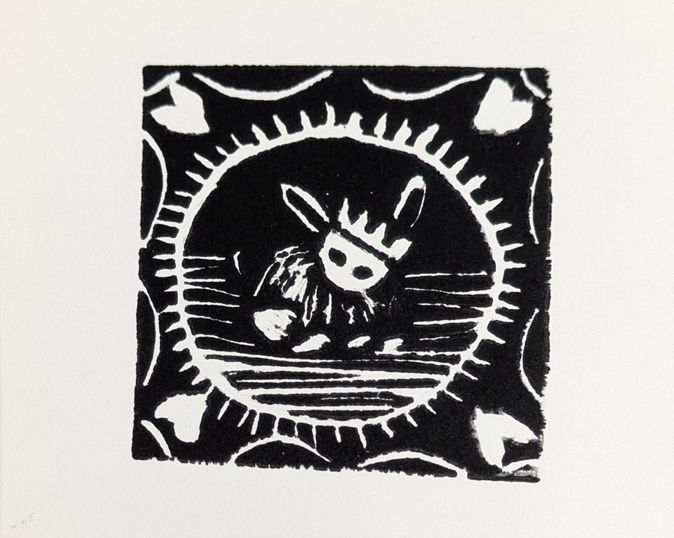 print of person wearing crown, hearts in corners