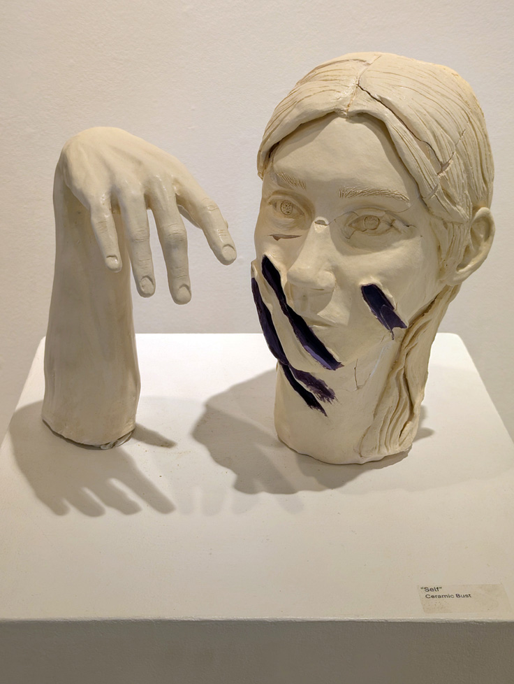 portrait bust and sculpture of forearm and hand
