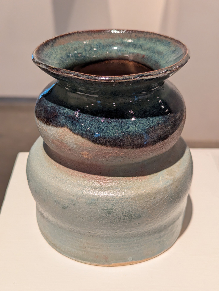 vase with wavy sides, blue top, white bottom