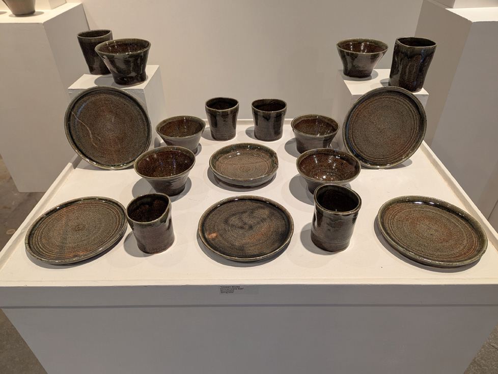 set of green-brown plates, bowls, and cups
