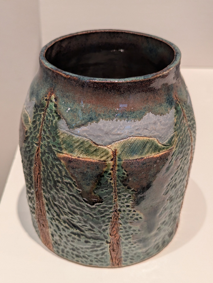 vase with landscape carved and painted with glaze