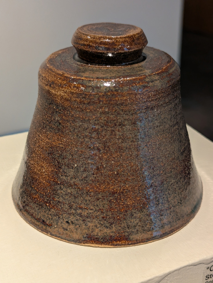 brown, bell-shaped ceramic