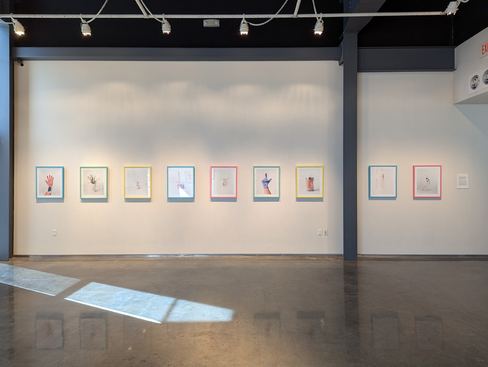series of framed prints on wall