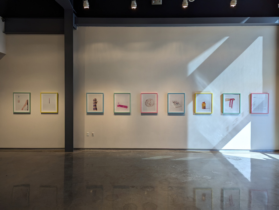 series of framed prints on wall