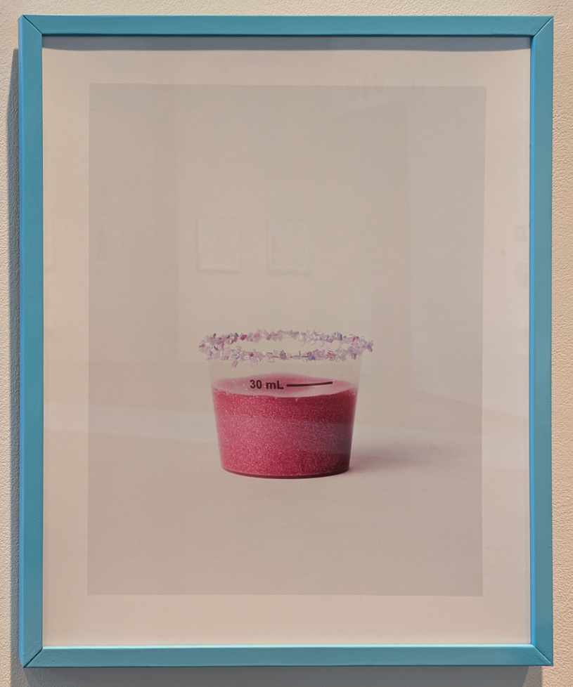 medicine cup rimmed with glitter