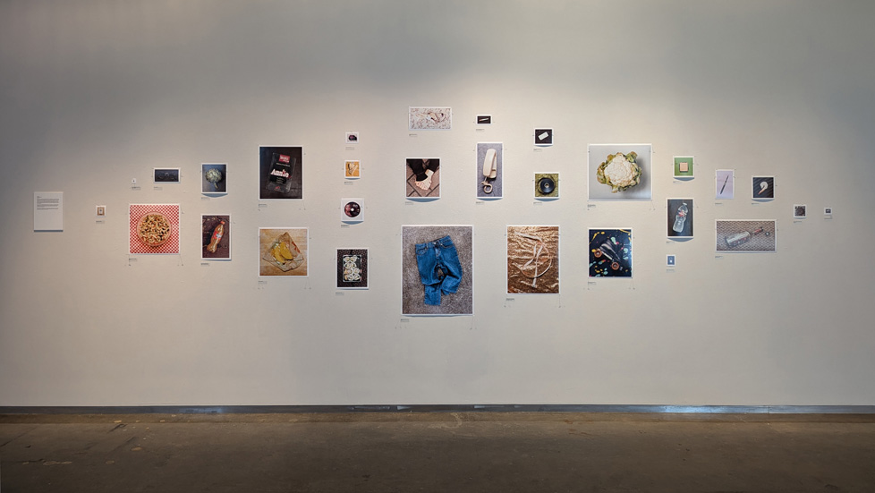 collage of loose photos in different sizes pinned to wall