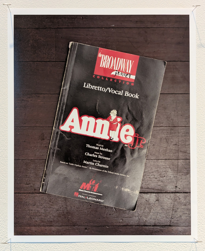 Annie jr. libretto on wood floor