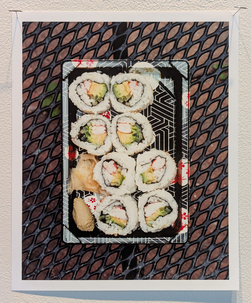 tray of sushi on expanded metal table