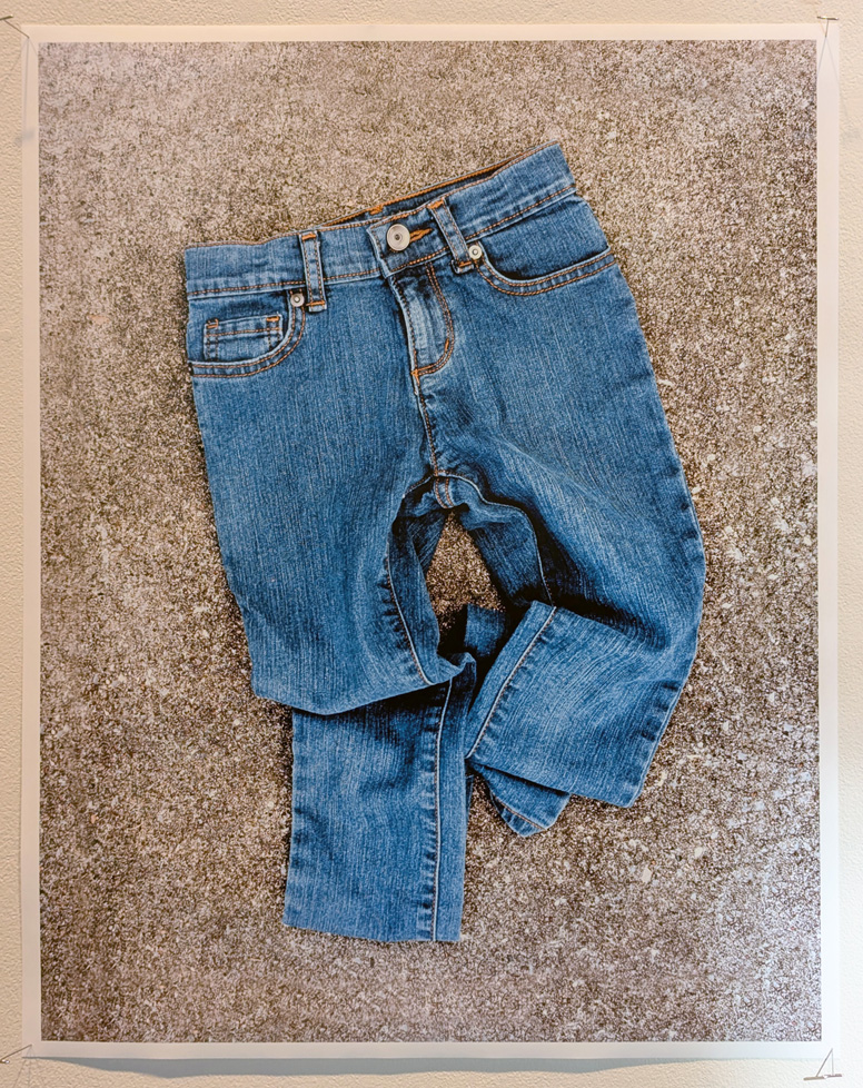 crumpled blue jeans on carpet