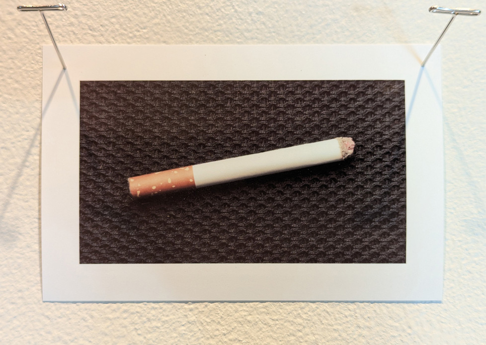 cigarette on what looks like an office chair seat