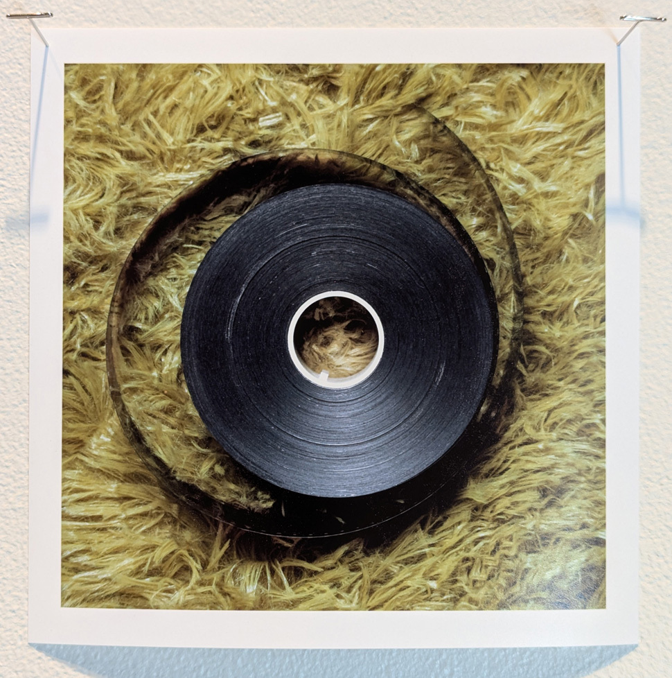 tape on a spool on shag carpet