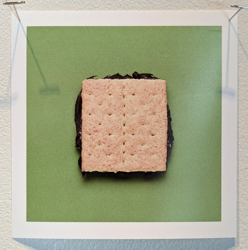 cracker sandwhich, maybe a smor on green fabric background
