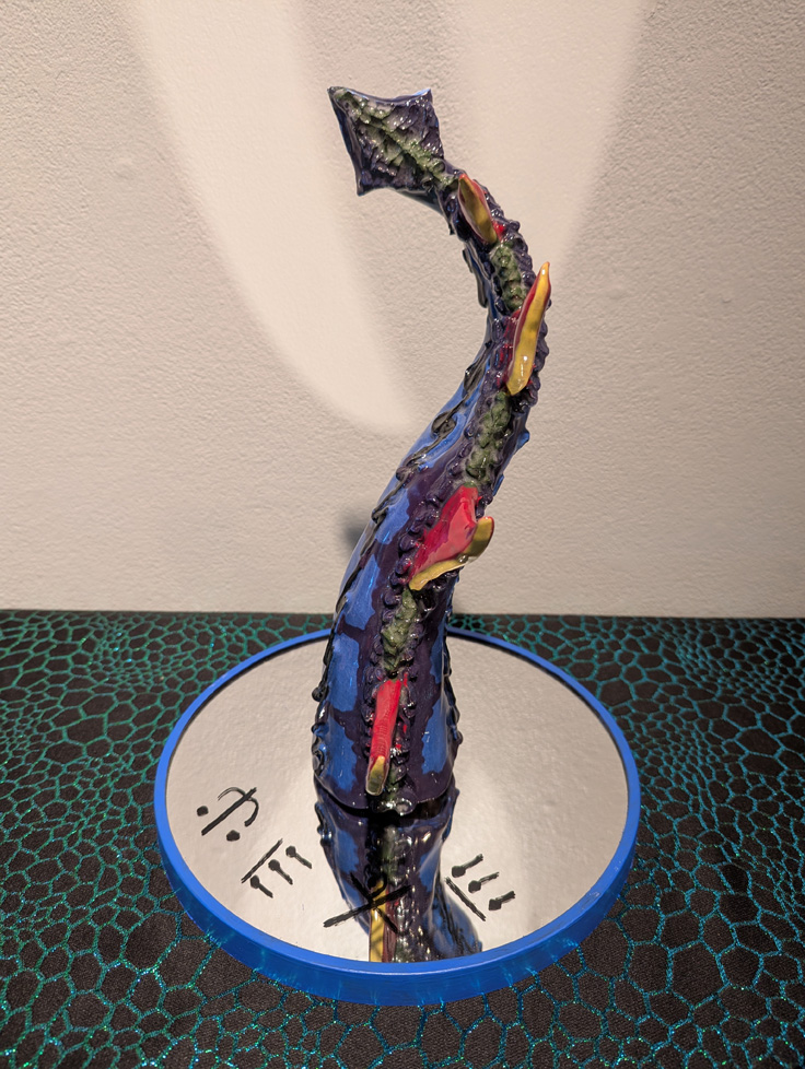 detail of colorful tail on mirror with text