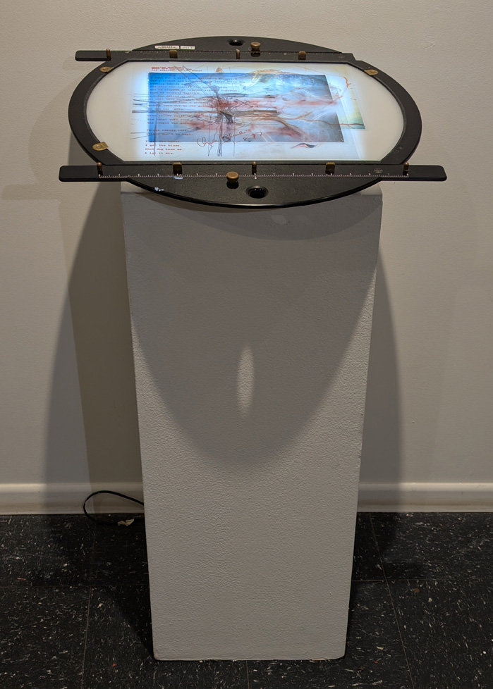 round lightbox apparatus with Bukowski poem and layered imagery of doe and perhaps medical diagrams