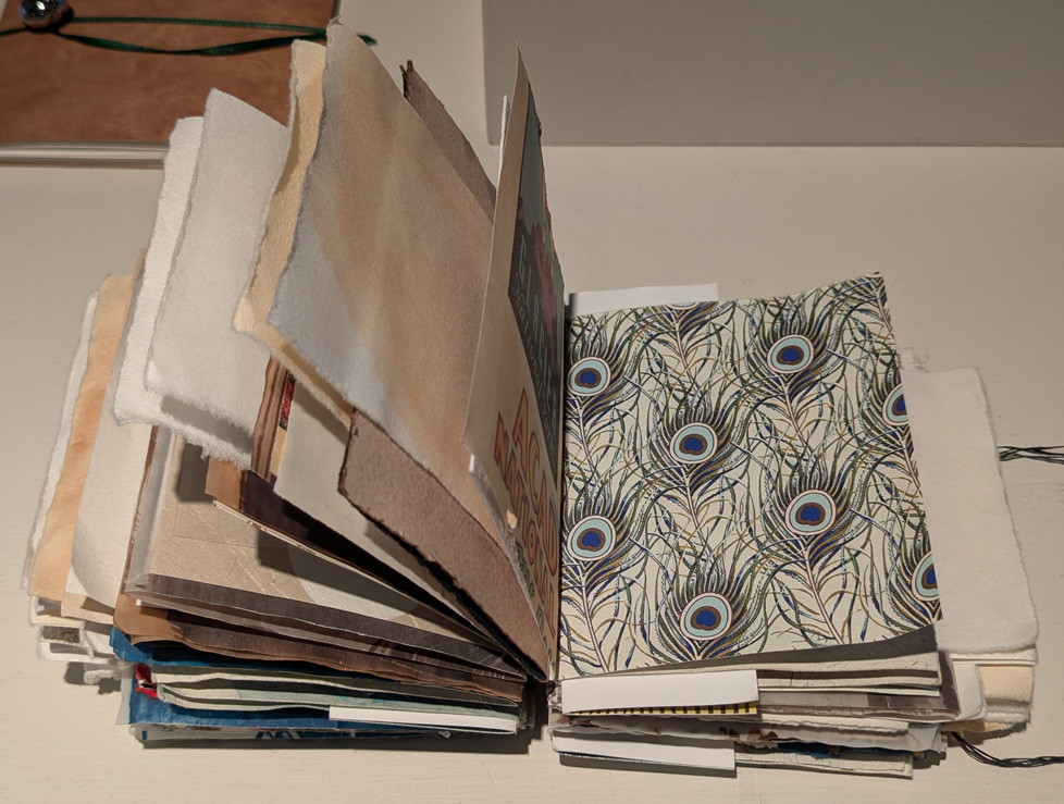 artist book: many mismatched types of paper bound together