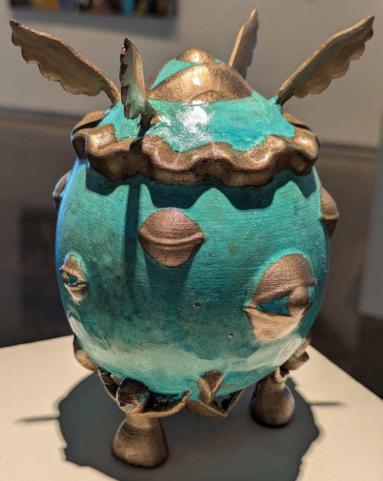 bronze cast of 3D printed sculpture: egg with eyes and wings