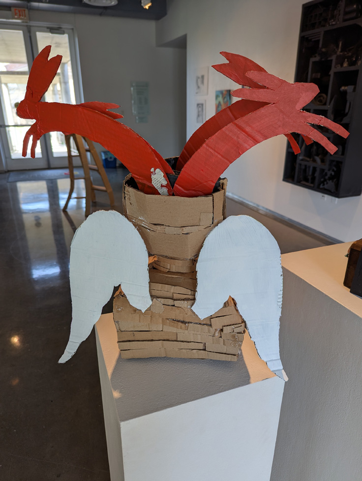 back of rabbit angel cardboard sculpture