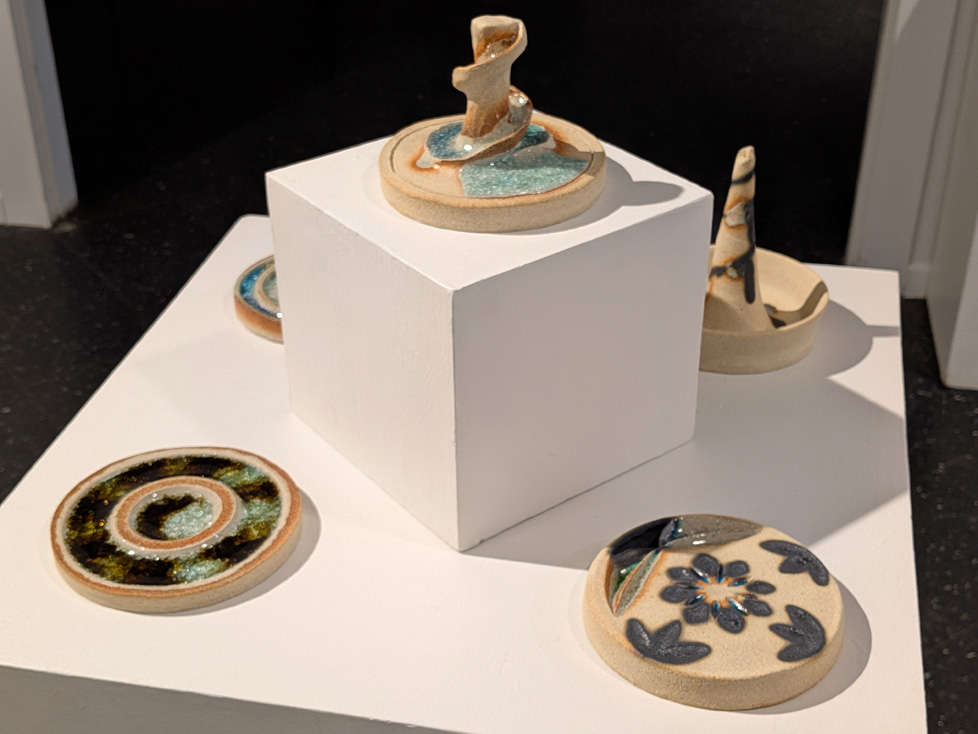 view 2 of ceramic discs on pedestal
