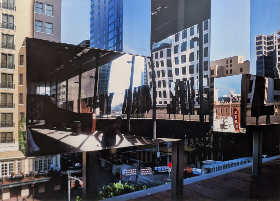 photo of reflections of buildings on buildings