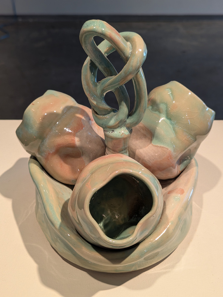 3 ceramic cups, green/pink on stand