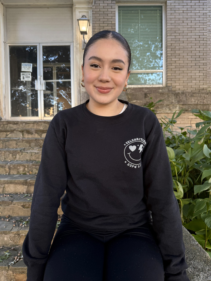 Mariana sitting on stoop