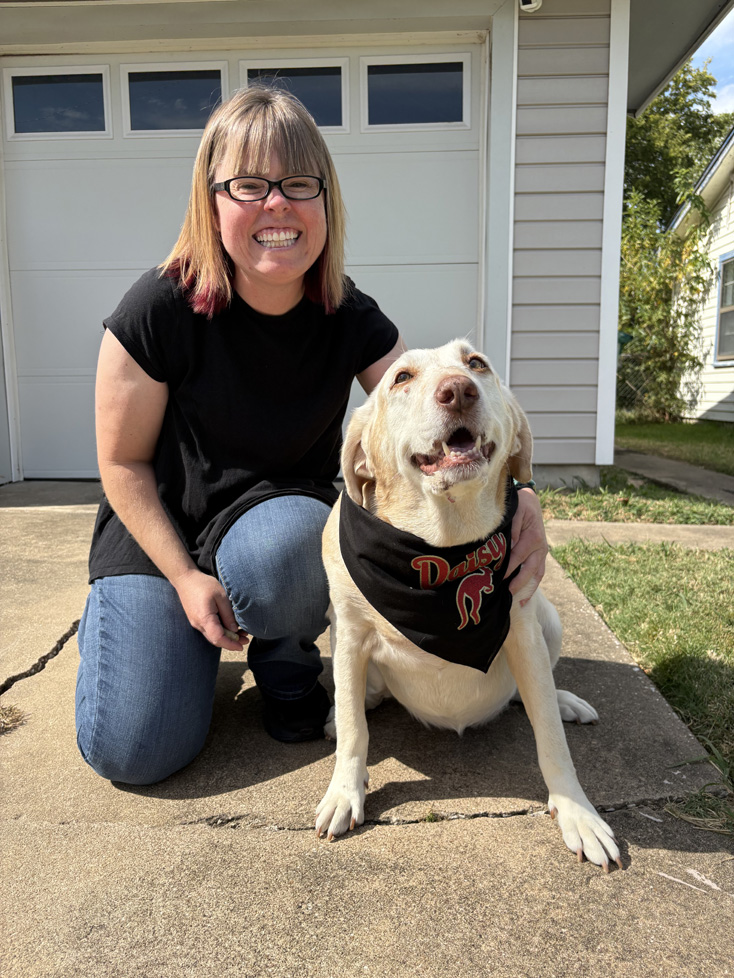 Jessica with Daisy Roo (her dog) on driveway
