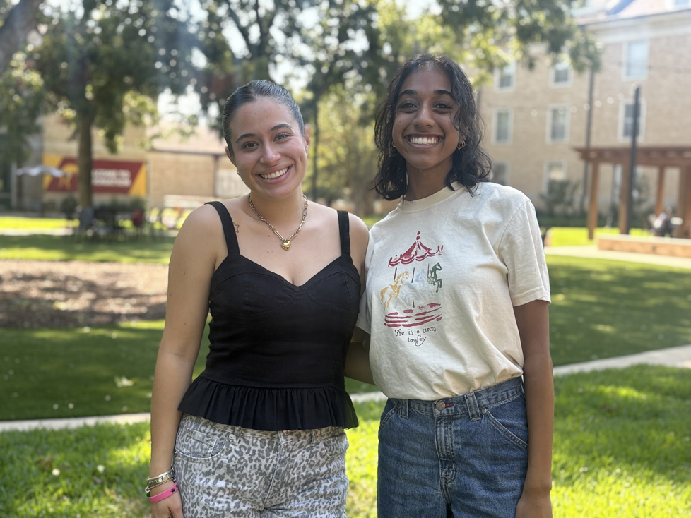 Renata & Prana arms around each other on campus
